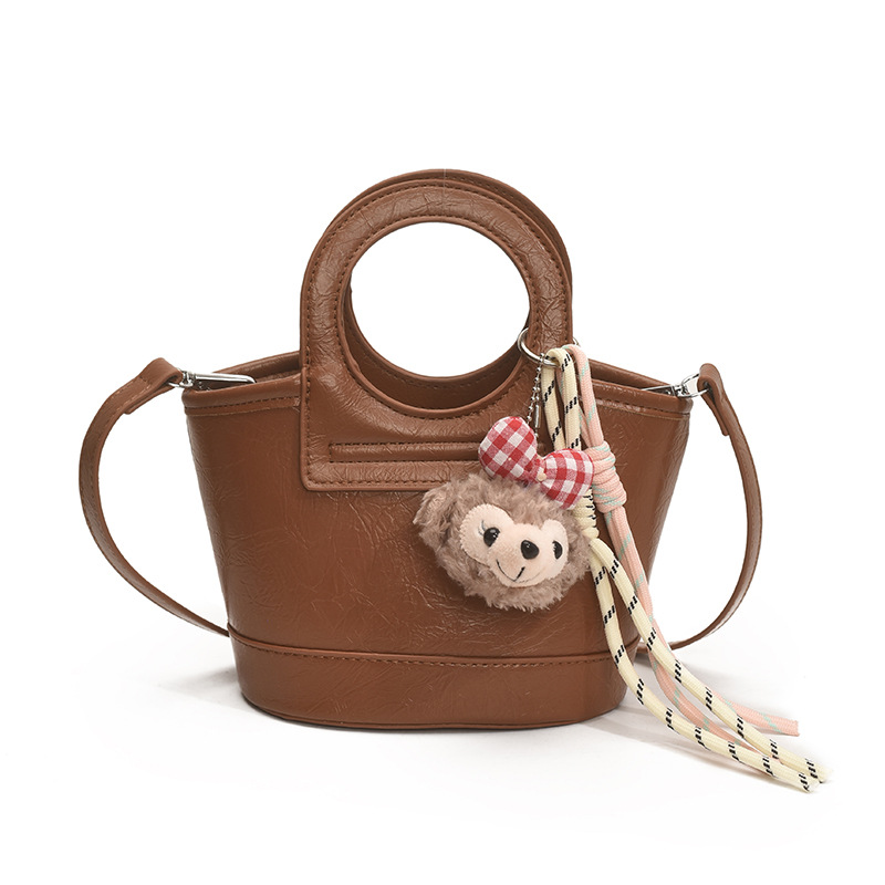 Bolso para mujeres 2026 nuevo nicho coreano de comida de mano cesta bolsa de cubo de textura alta de viaje mochila de hombro