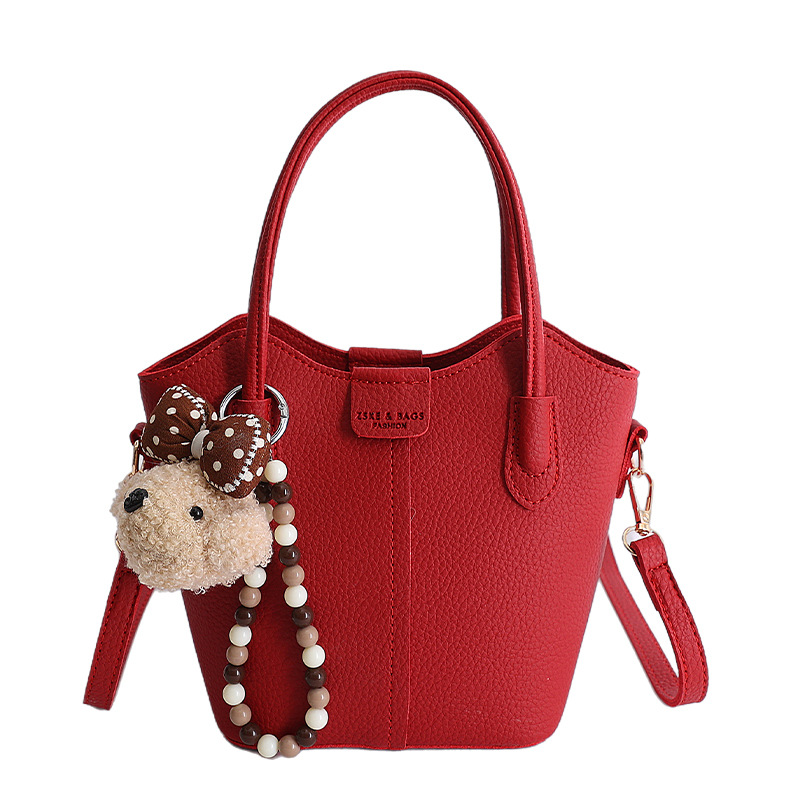 Bolso de mano de moda retro 2026 nuevo temperamento simple bolso de cubo de viaje ocio mochila de hombro