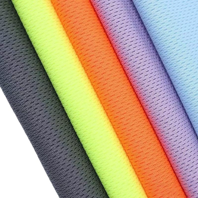 Tejido de ojo de pájaro de poliéster nueve grados absorción de sudor tela de malla de secado rápido poliéster tela de camiseta de arroz
