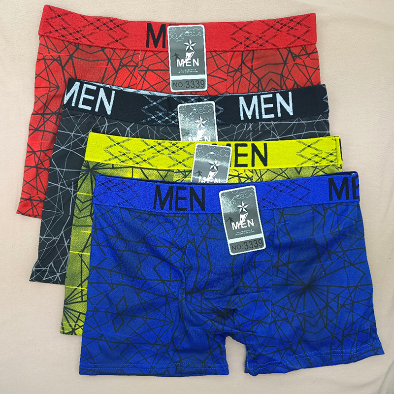 Pantalones de boxeador para hombres europeos y americanos Impresión de seda de leche tamaño libre pantalones de cuatro lados para hombres puestos de bajo precio transfronterizos especiales