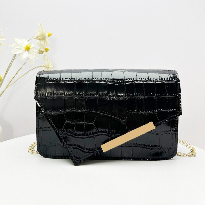 Una bolsa cuadrada con patrón de cocodrilo con tapa de tesoro de primavera y verano de 2025, nueva versión coreana de mujeres con un hombro inclinado, bolsa de cambio.
