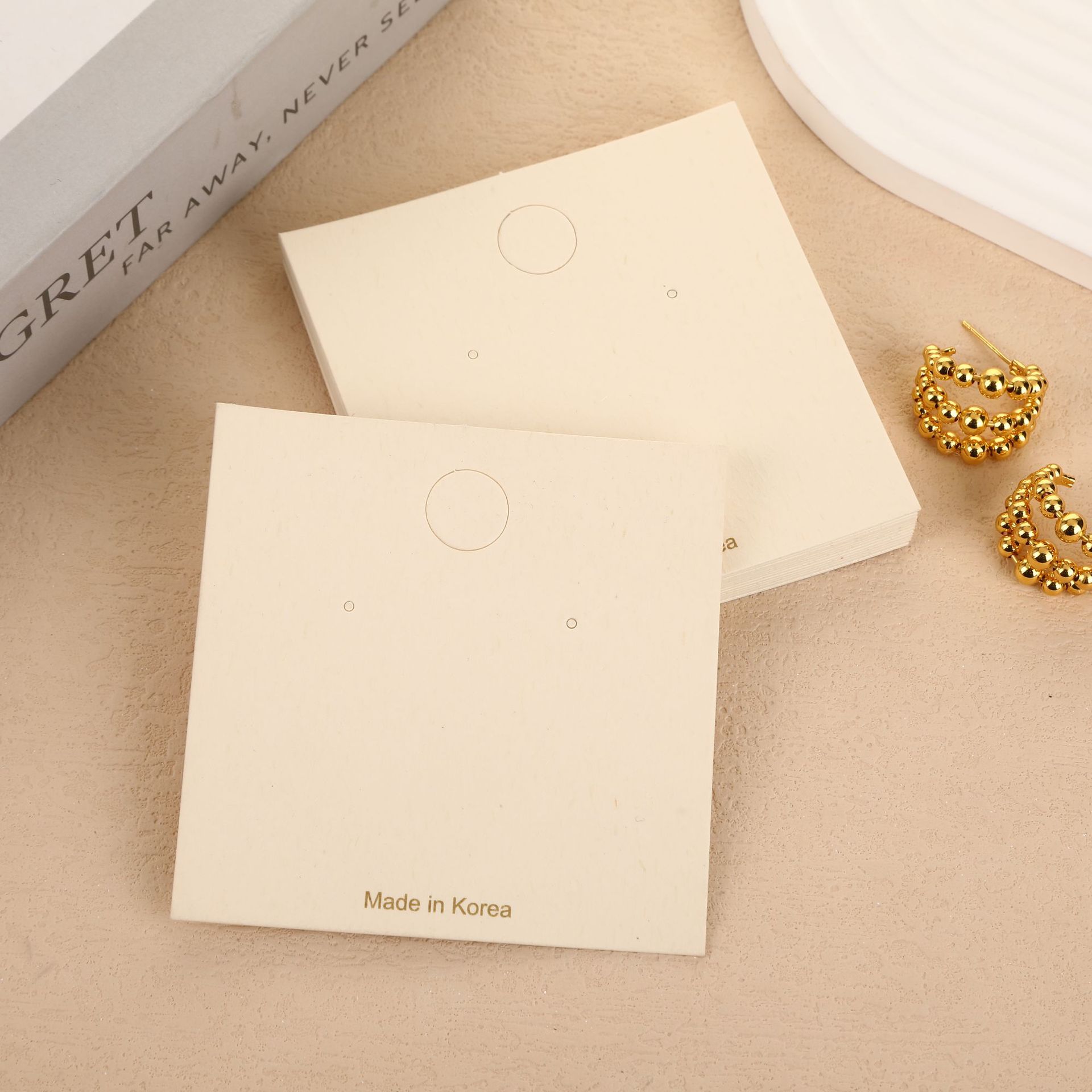 Fábrica directa de aretes explosivos joyas de embalaje tarjeta de papel de hierba tarjeta blanca en stock al por mayor