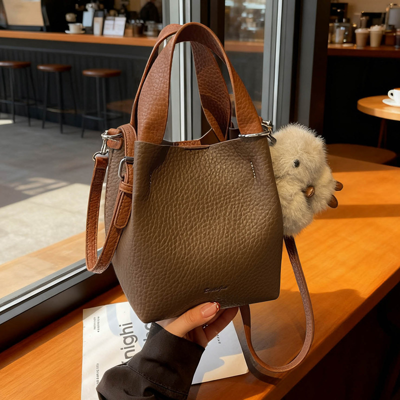 Bolso coreano con estampado de litchi para mujeres 2025 nuevo bolso de cubo de alta calidad de moda versátil bolso de hombro