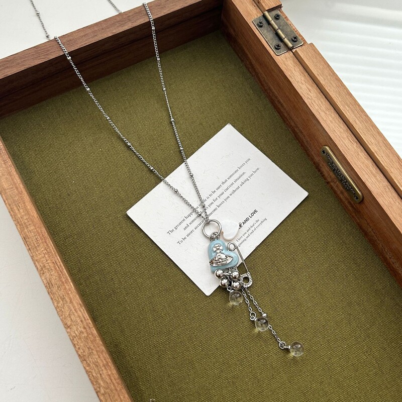 ダイヤモンドがちりばめられたラブレザーバッグペンダントロングネックレスレディースニッチデザインファッショナブルで多用途なセーターチェーン|undefined