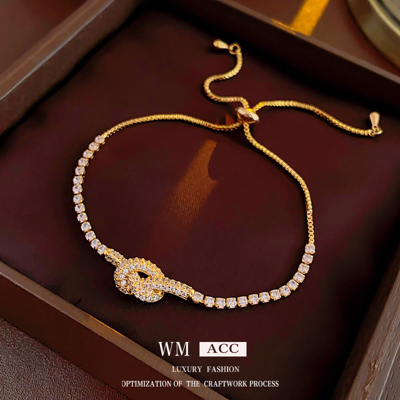 Real oro galvanizado ZIRCON anudada pulsera hueco simple pulsera elegante luz lujo alto sentido pulsera para las mujeres al por mayor
