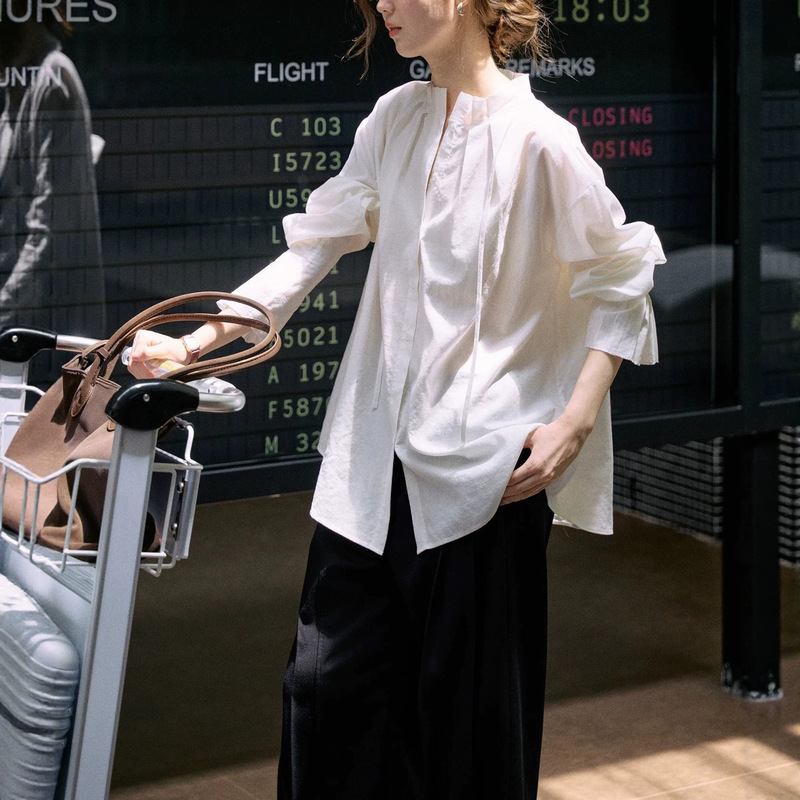 Jicouture women's white shirt with a unique design, made from a silk-linen-lyocell blend, featuring a tailored cut Jicouture women's white shirt with a unique design, made from a silk-linen-lyocell blend, featuring a tailored cut
