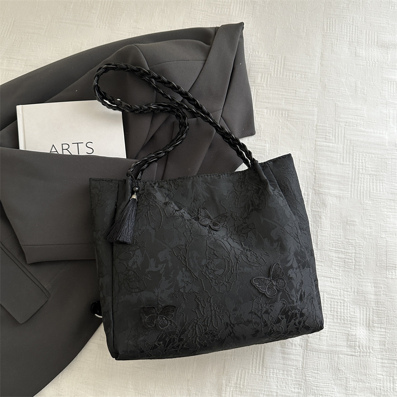 Bolso de viaje de seda de mariposa de alta calidad de nicho 2025 verano nuevo bolso de mujer simple de gran capacidad nuevo estilo chino