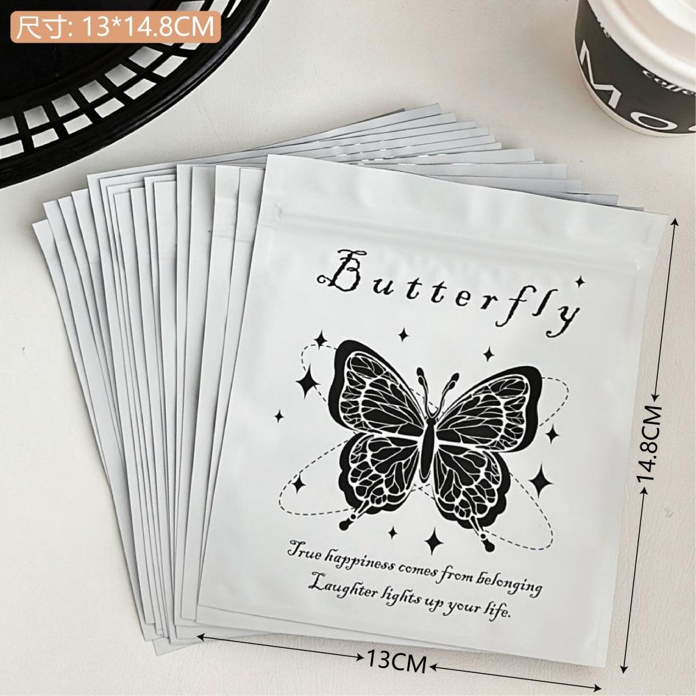 Bolsa de alto valor negro y blanco mariposa auto-sellada, pequeña bolsa de regalo, bolsa de embalaje de regalo, bolsa de sellado de viento, pequeña bolsa ciega