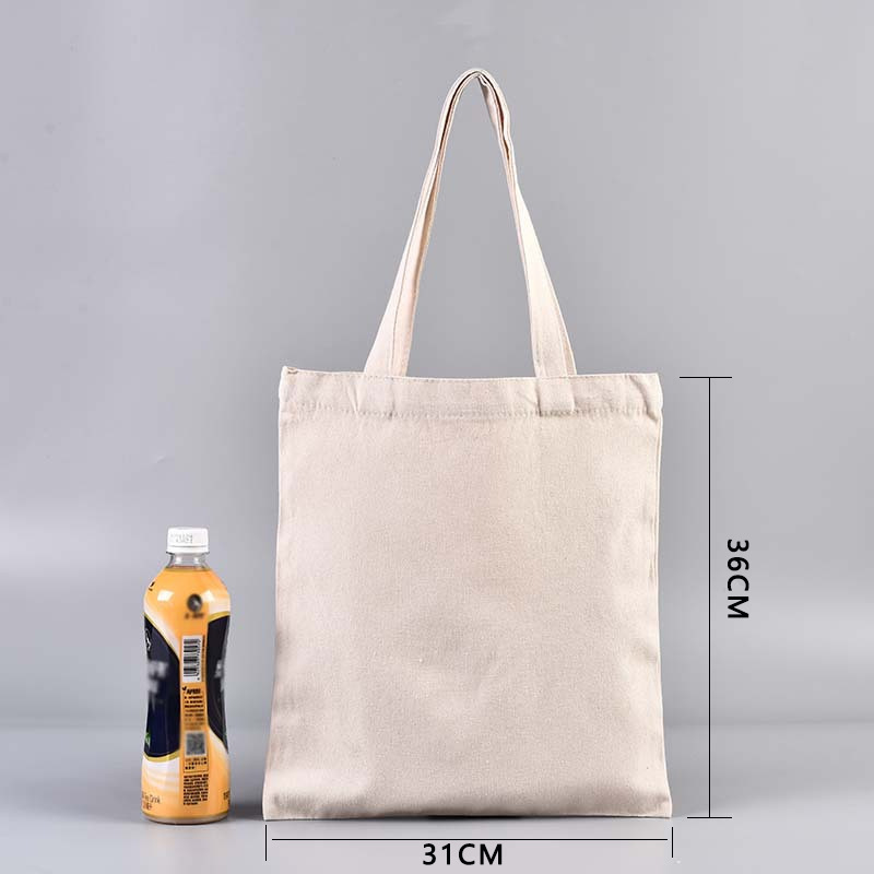 En stock bolsa de lona portátil en blanco personalizable logotipo de impresión en color de un solo hombro bolsa de compras bolsa de algodón de entrenamiento publicitario