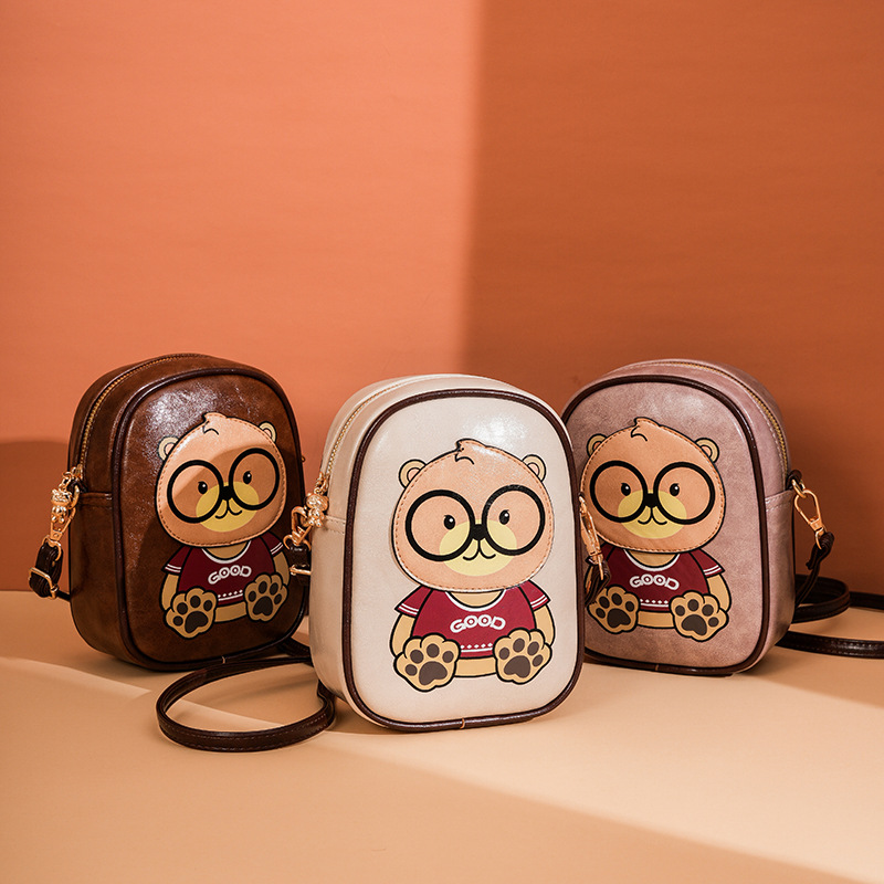 2025 nuevo oso de dibujos animados bolso de teléfono móvil de moda femenina versátil bolso de hombro adorable mini bolso vertical
