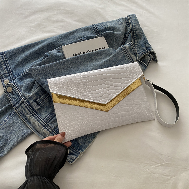 Bolso de mano sobre 2024 otoño nuevo estilo personalidad coreana moda femenina de moda temperamento casual todo-fósforo banquete pequeño bolso