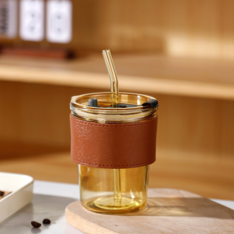 Tazas de vidrio de bambú en línea resistentes al calor tazas de paja de café ins viento alto valor de mano impresión de tazas de agua de regalo