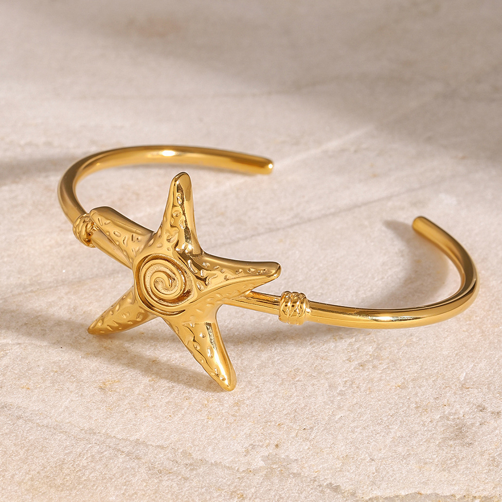 Jieding Europa y América Pulsera abierta de estrella de mar de acero inoxidable Pulsera de océano de sentido avanzado Pulsera de acero de titanio Bracelet transfronterizo