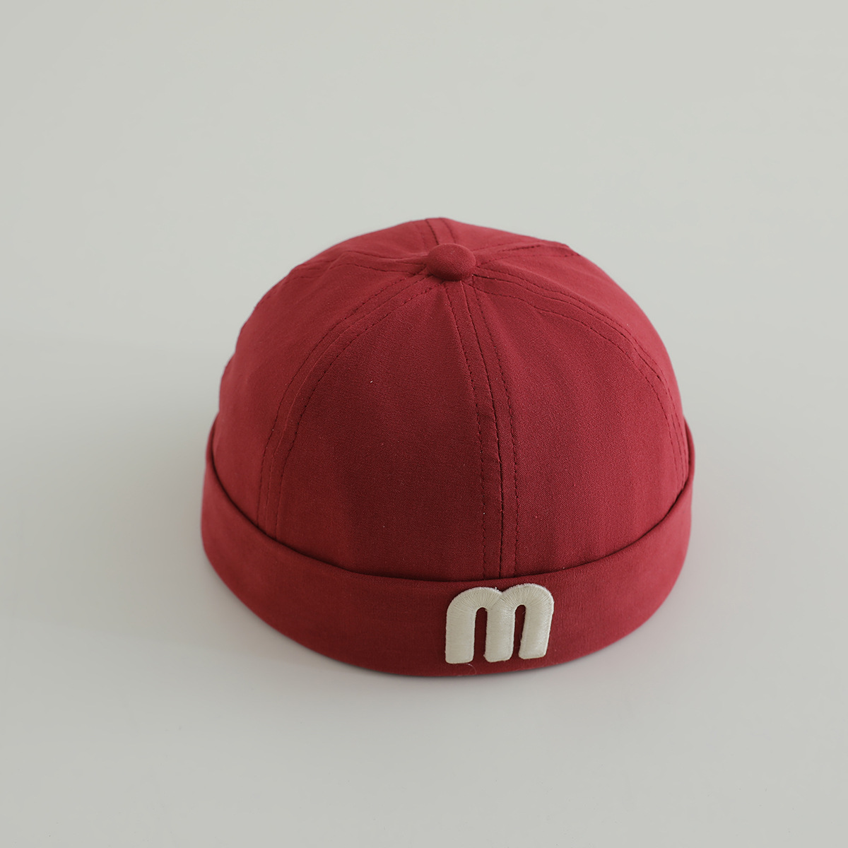 letras coreanas m niños terratenientes sombrero primavera y otoño modelado cóncavo de moda para hombres y mujeres bebés sombrero de tela de color sólido