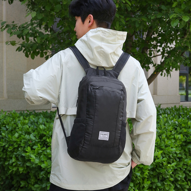Ultra light handheld folding backpack for traveling
