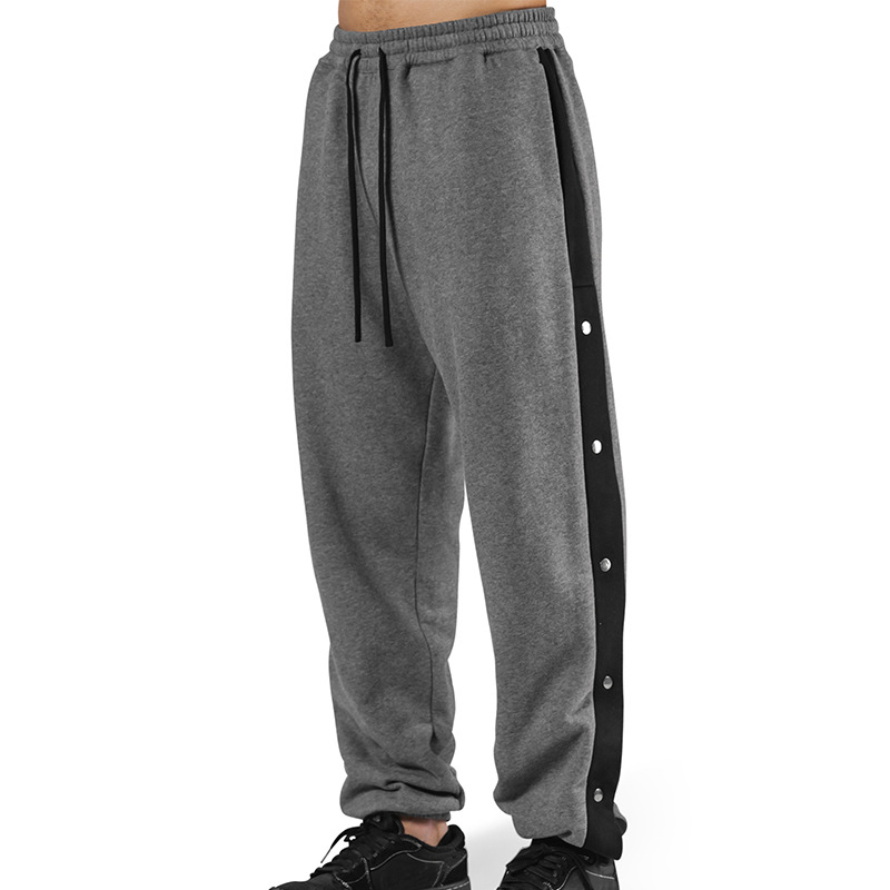 Los deportes de otoño e invierno de los músculos locos están completamente abiertos con hebillas y pantalones de terciopelo. los hombres están relajados y relajados. los pies están atados en otoño e invierno y los pantalones deportivos de terciopelo.