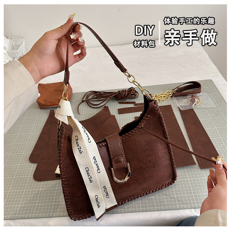 Bolsa de material de estilo británico bolsa de axilas de Superficie suave DIY hecho a mano tejida bolso diseño sentido no colisión solo bolso de hombro