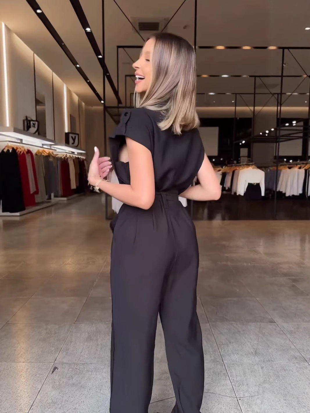 Moda transfronteriza europea y americana ropa de mujer hombro deslizante sin mangas cinturón de trabajo viento multi-bolsillo plantares 2025 nuevo