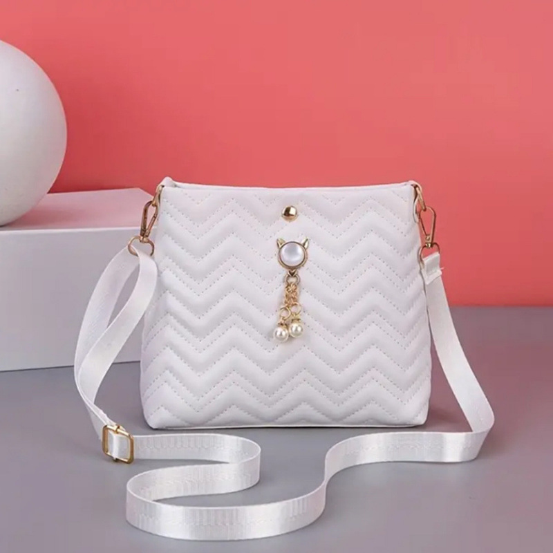 Moda coreana ondulada estriada felina colgante de perlas decoración simple bolsa de mujer mochila al por mayor bolsa image 6