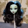Green face blue black hair