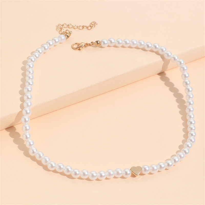 Collier élégant et raffiné, style Ins Style Niche Pearl, pour femme. Pendentif cœur ajouré, chaîne ras du cou légère et luxueuse._voghion.com