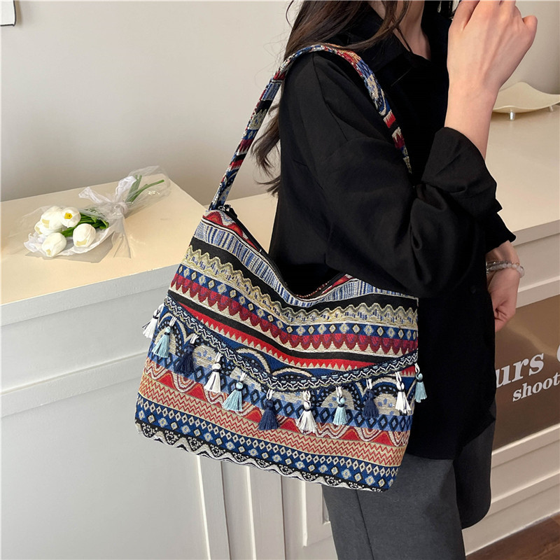 Bolsos de gran capacidad de estilo nacional para mujeres 2025, nueva moda extranjera, bolsas de hombro de borda, bolsas de compras al aire libre