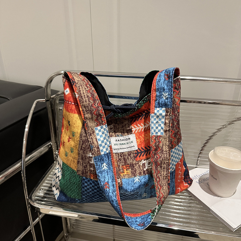 2025 primavera y verano estilo nacional denim tendencia nueva mochila de hombro de gran capacidad mochila de pulsación de la moda