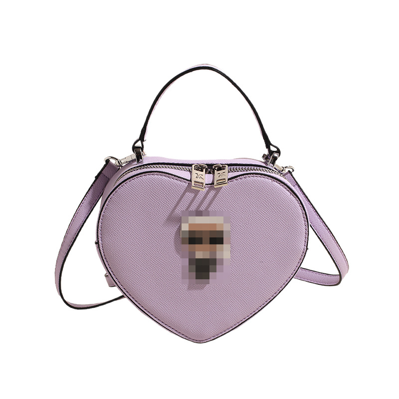 Bolsos transfronterizos para mujer 2024 nuevo bolso de hombro con diseño de corazón de nicho de moda bolso de mensajero portátil de amor de alta gama
