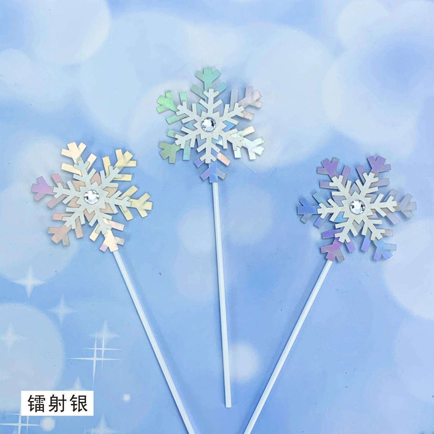 Tres juegos de copos de nieve de plata láser