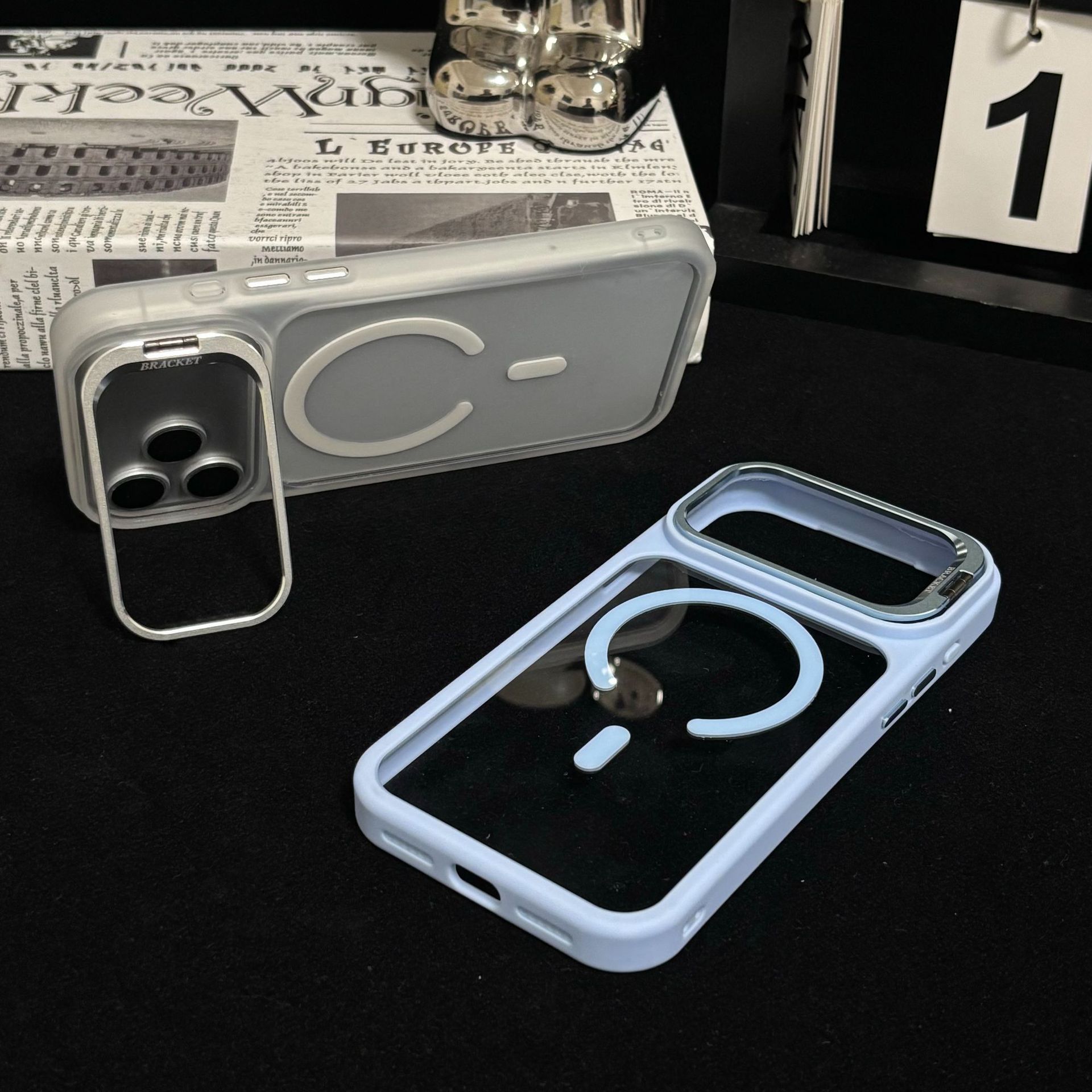 Funda Magnética con Soporte de Lente para iPhone 16/17 Pro Max de Acrílico Transparente Anticaídas