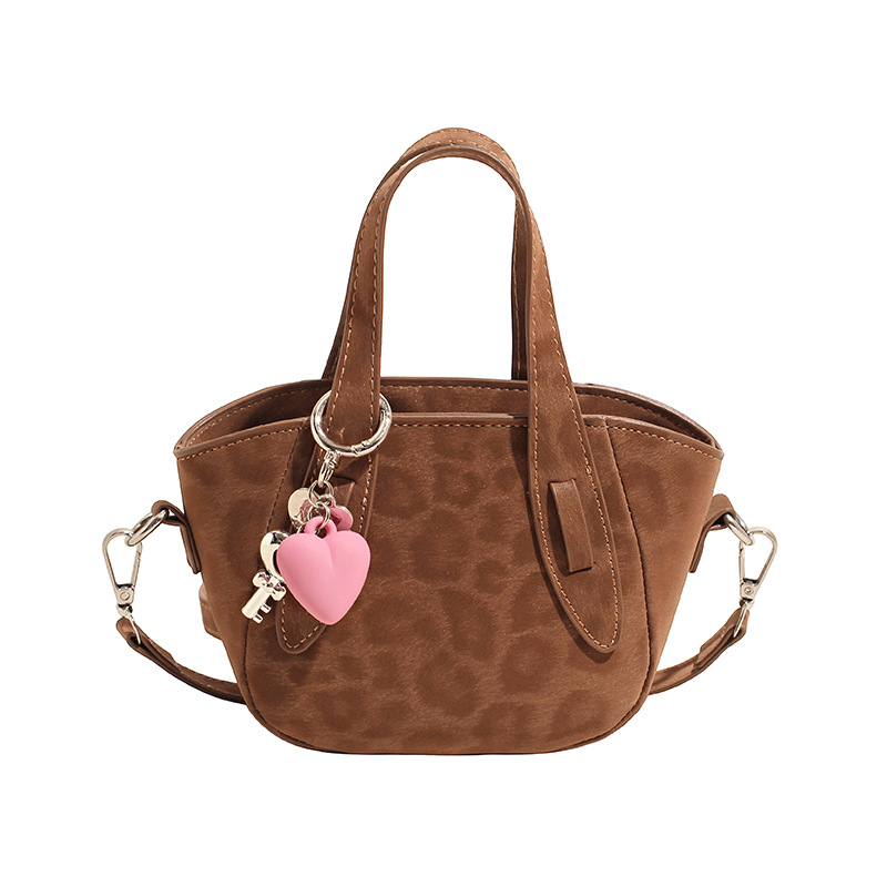 Retro nicho leopardo bolso de cubo de mujer otoño invierno 2025 nuevo tipo de bolso de cestas de verduras de mano bolsa de hombro casual mochila moda