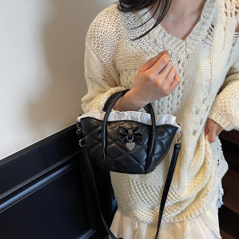 Versión coreana del bolso de nicho 2025 verano nuevo bolso femenino lindo lazo bolso de hombro bolso de mensajero bordado de diamantes