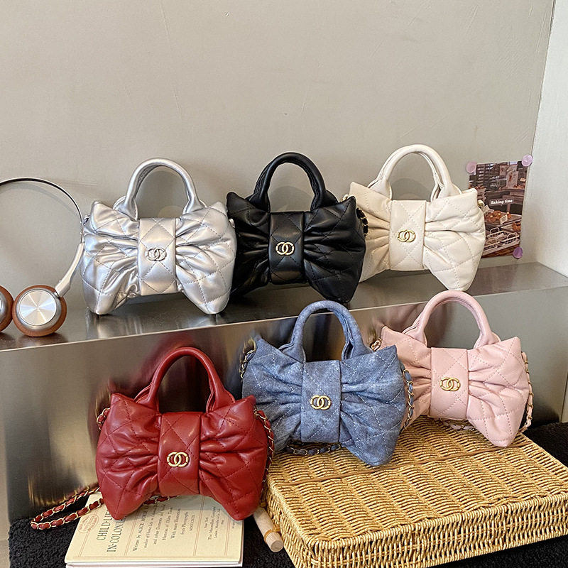 Bolsa de mano de chicas arco dulce cadena de diamante pliegue bolso de hombro 2026 nuevo bolso infantil transfronterizo