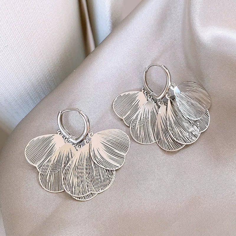 57 # Silver hollow heart petal tassel earrings
