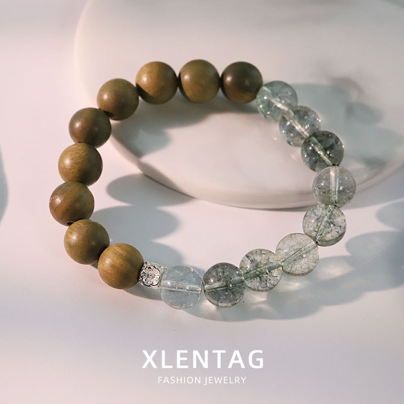 Diseño original de madera de sándalo grieta de cristal cuentas pulsera temperamento retro pulsera de moda versátil alta sensación joyas de la mano