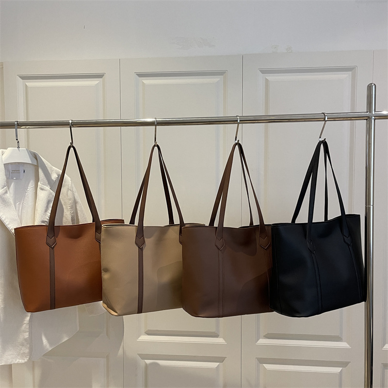 Bolso coreano de gran capacidad de alta calidad para mujeres 2025 nueva moda retro bolso de viaje tote simple bolso de hombro de color sólido