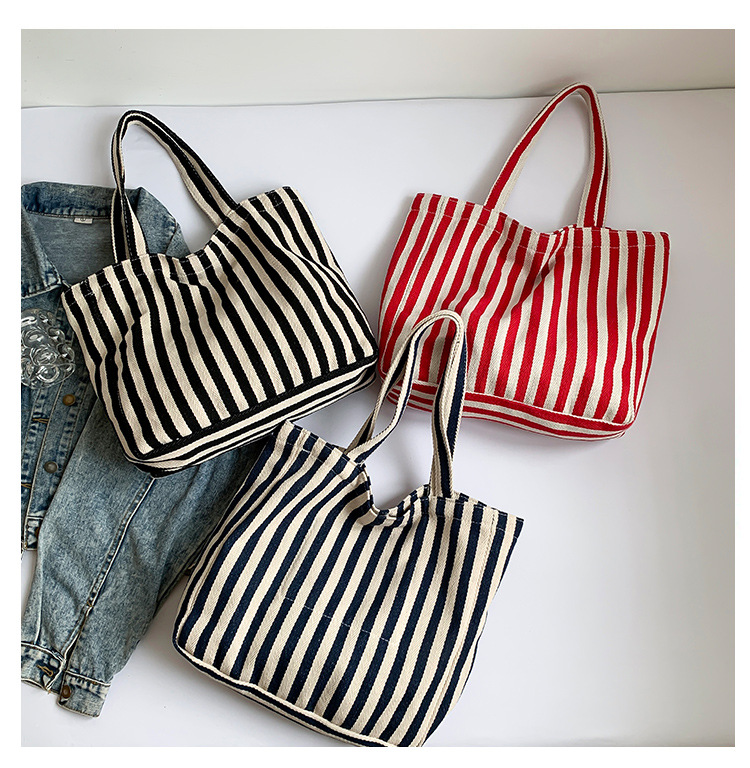 2024 Autumn/Winter new versatile and fashionable striped handbag shopping bag, two-tone large-capacity trendy single-shoulder bag undefined
