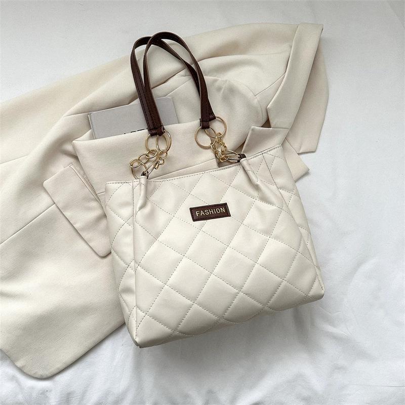 Bolso de gran capacidad de ocio para mujeres 2023 primavera nueva simple estilo extranjero de transporte de mochila de moda textura tote