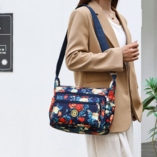 地摊包包批发新款花布包牛津布单肩斜挎包实用中年女包帆布背包