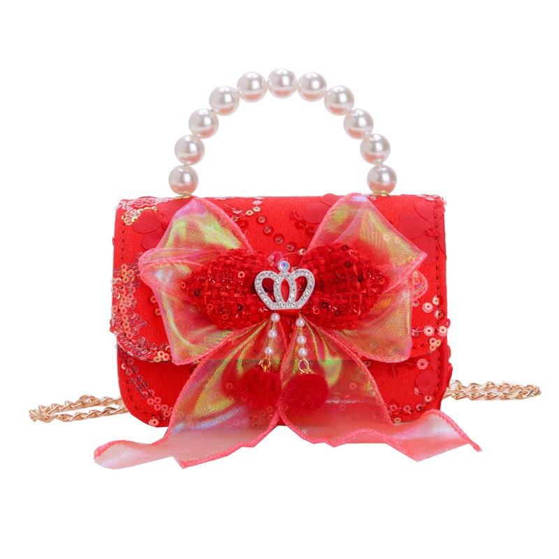Nuevo bolso de hombro de niñas lindo arco bolso de perla bebé 2025 bolso rojo pequeño viento perfumado bolso para niños