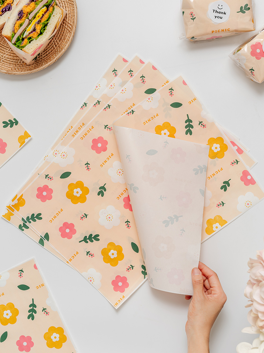 Papel de embalaje de sándwich impermeable a prueba de agua a prueba de aceite de grado alimenticio papel de película de limpieza de hamburguesas perros calientes mano agarrar pastel papel de embalaje comercial doméstico