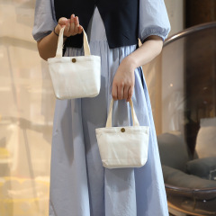 日韓insキャンバスバッグ純白携帯ミニ純色ハンドバッグカジュアル可愛い女性通勤キャンバスバッグ