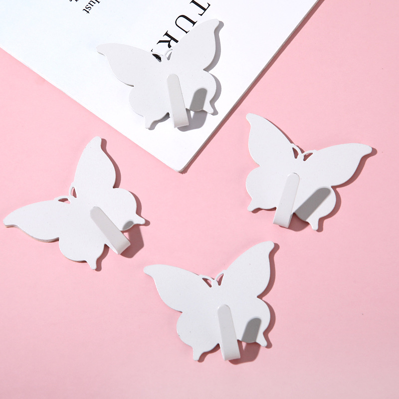 Gancho de mariposa fuerte sin agujeros ins viento encantador gancho adhesivo de corazón de niña decoración de pared de habitación gancho adhesivo de alto valor visual