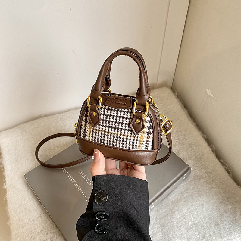 Mochila de moda de leopardo para niñas, mini bolso de concha portátil para bebés, 2025 nuevo bolso de comercio exterior para niños