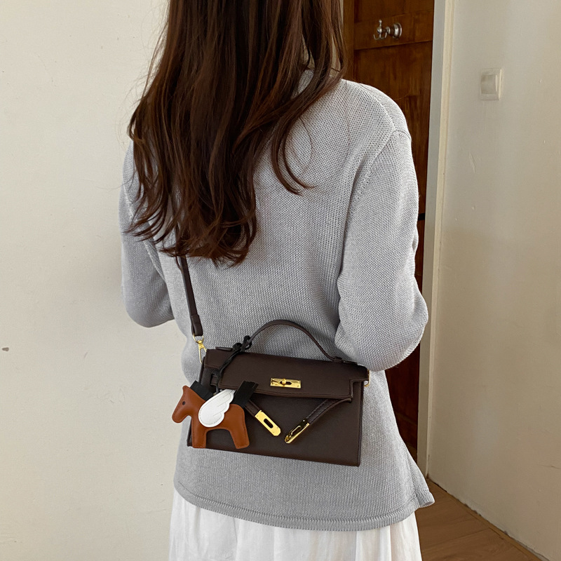 Texturas bolsos Kelly mujeres 2026 verano nuevo estilo de moda simple mochila diaria bolso de mano super caliente bolso pequeño image 4