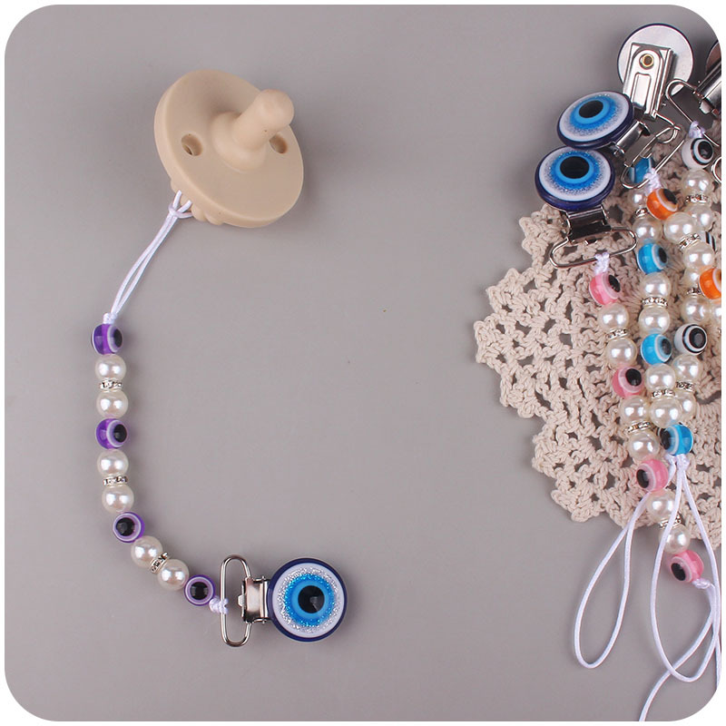 Suministros para bebés chupete de acrílico cadena anti-gota ojos azules bebé chupete clip chupete cadena Amazon nuevo