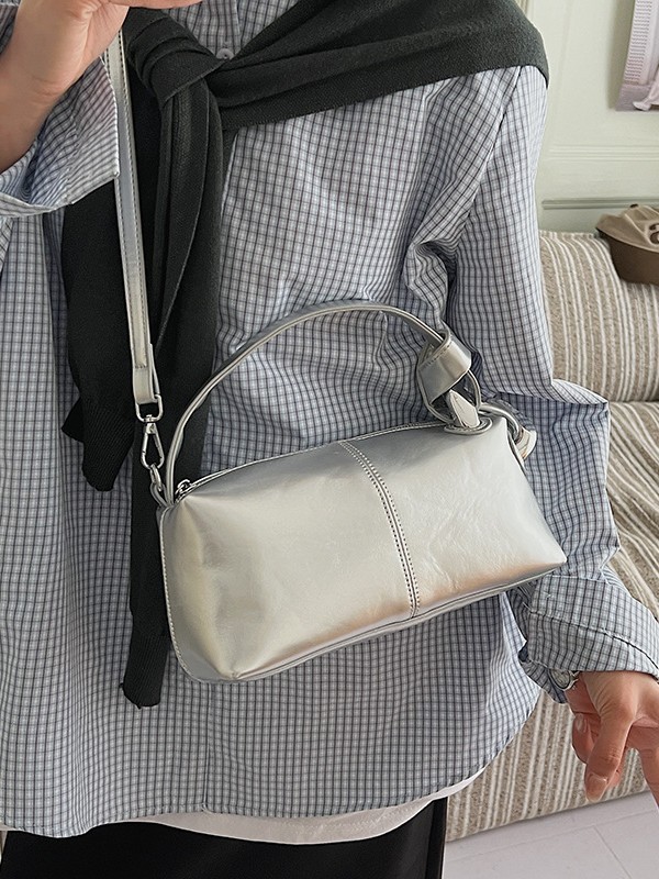 Transfronterizos de alta calidad de tela de cera de aceite bolso de almohada de mano para mujeres 2026 nueva moda lujosa ligera versátil mochila
