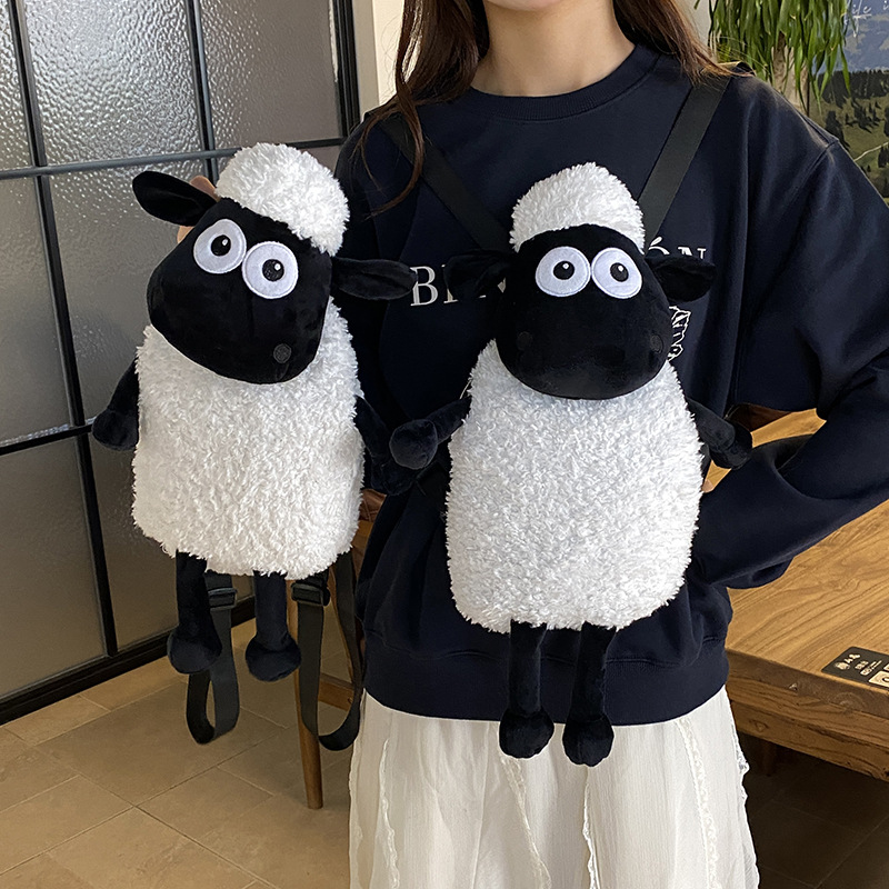 Cute cartoon-style plush toy bag featuring a long-handled, long-legged, realistic-looking lamb with a black face; a children's backpack