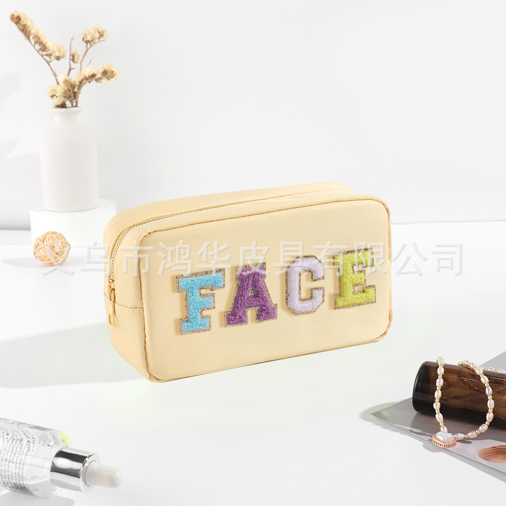 Transfronterizo amazon popular toalla bordada carta de nylon bolsa de cosméticos bolsa de almacenamiento de gran capacidad informal de las mujeres a prueba de agua