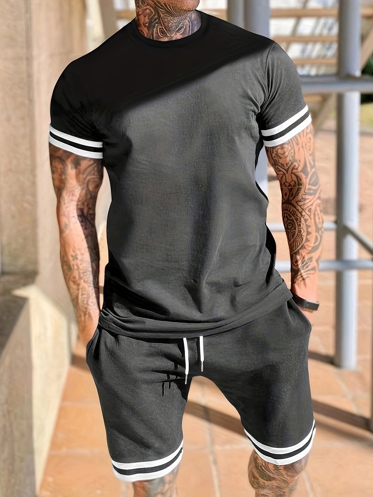 Europa y los Estados Unidos transfronterizos nuevos hombres de verano de manga corta camiseta de cuello redondo juego deportivo de pantalones cortos casuales de dos piezas para hombres